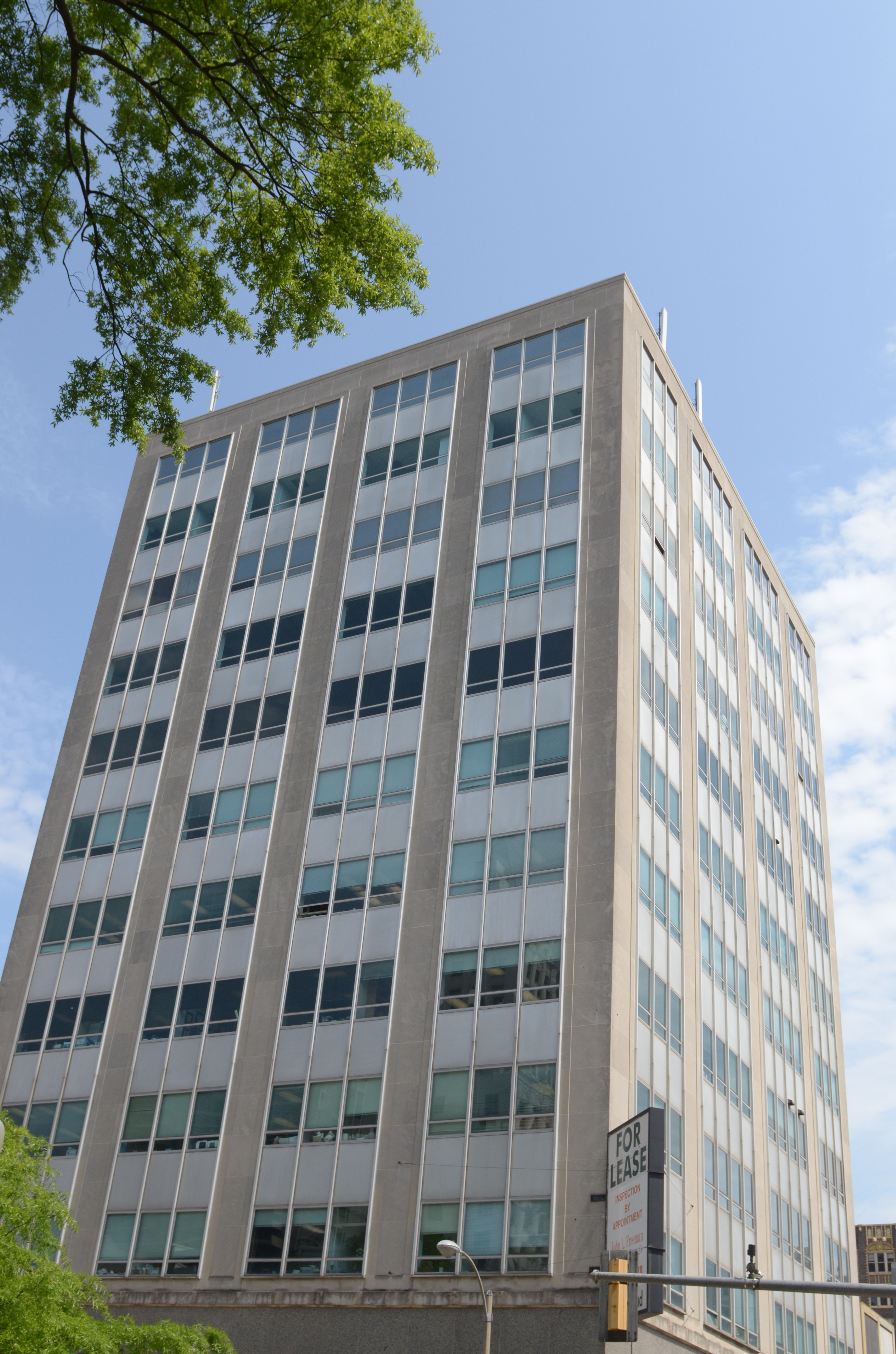The Grosvenor Building rising above the corner of Second and Court Streets